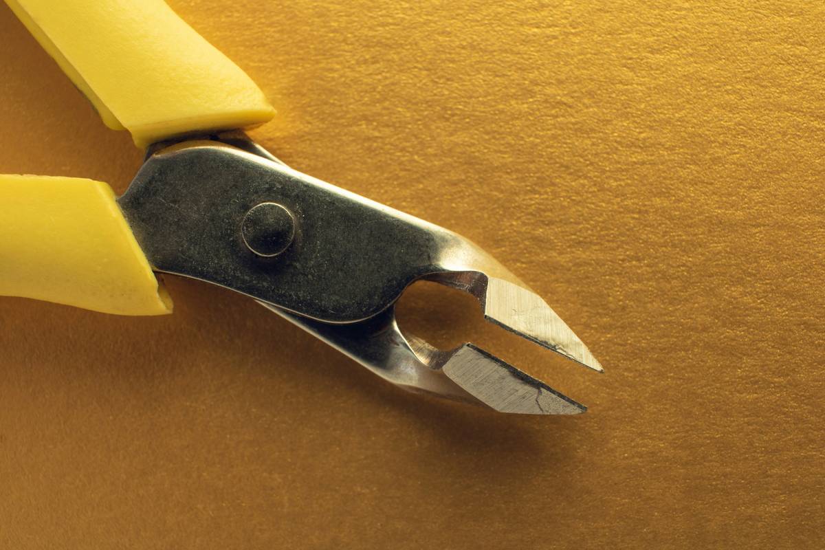 Carpenter installing multi material circular saw blade on cordless saw