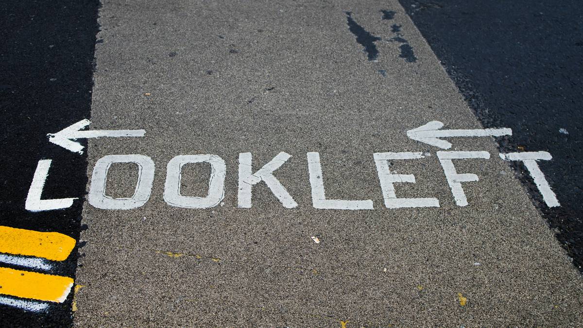 The text "look left" is written on the road